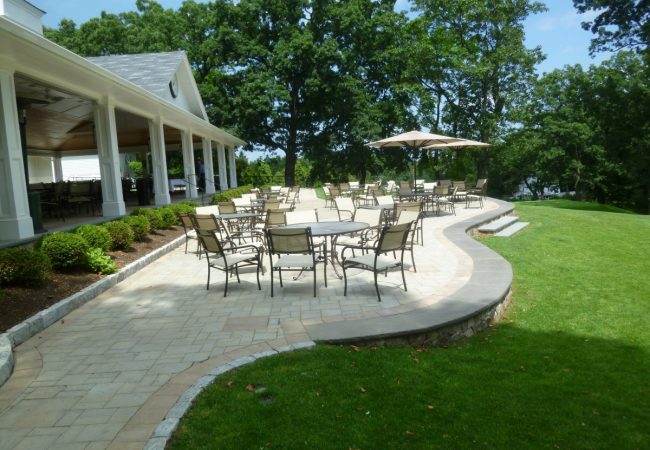 A dining terrace provides seating overlooking the 9th green.